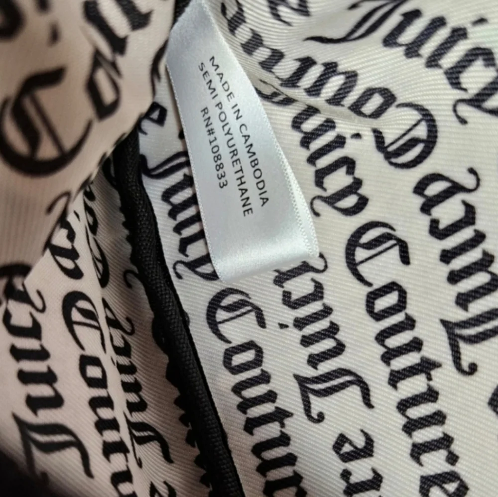 Juicy Couture black faux leather cosmetic clutch bag